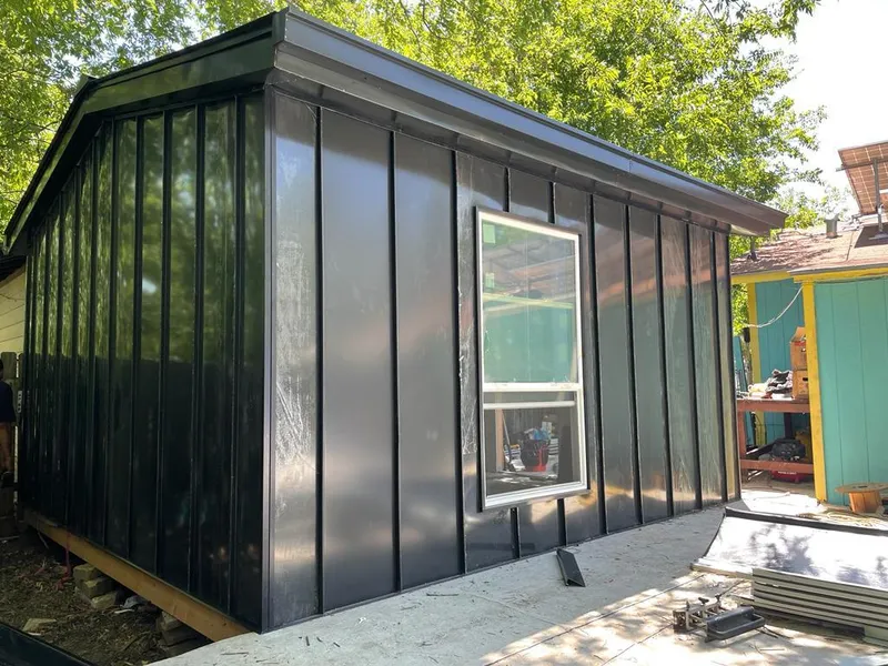 Black standing seam metal wall panels for Roof Inspection in West Melbourne