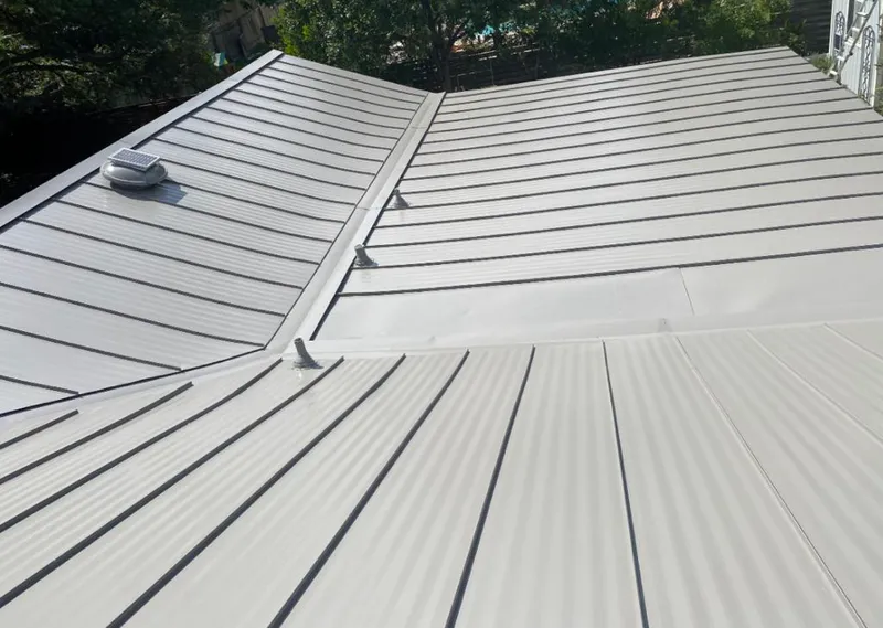 Solar attic fan installed on a metal roof for Roof Ventilation in West Melbourne
